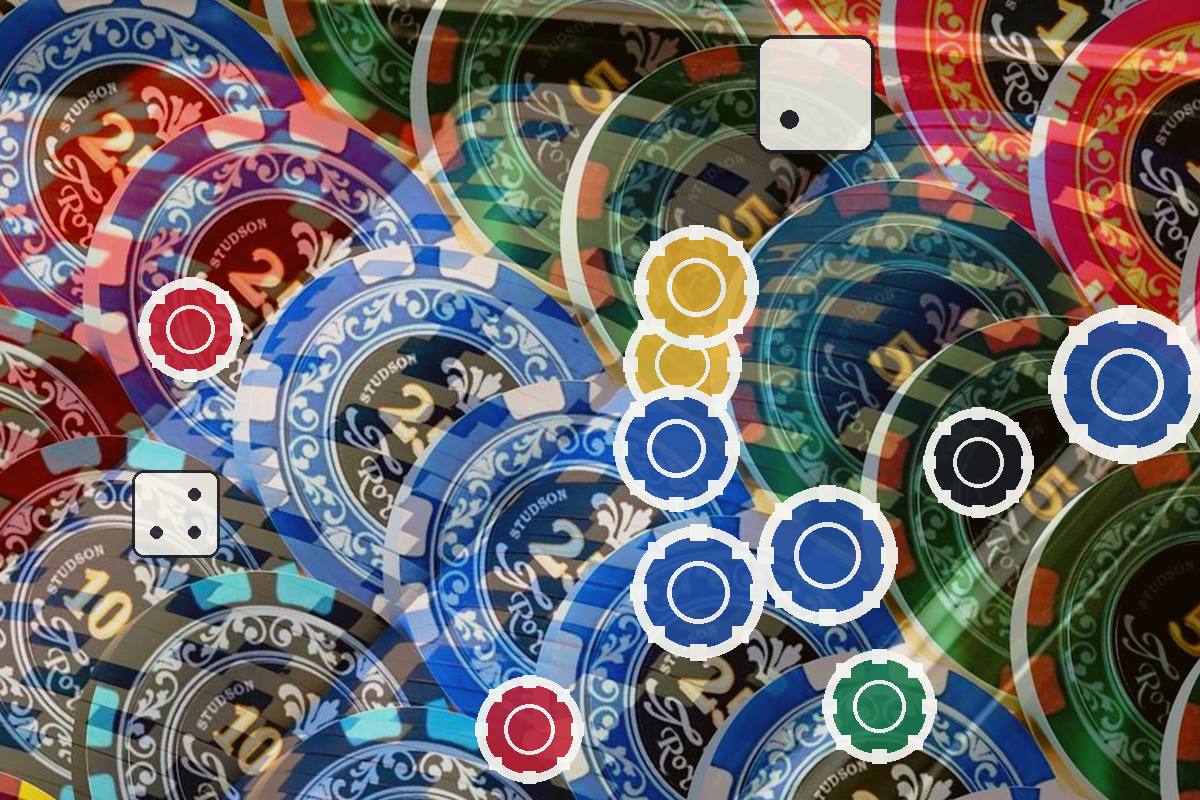 Pile of colorful casino chips overlapping, with a small white dice nearby and various colored indicators overlaying the scene, conveying gambling or gaming